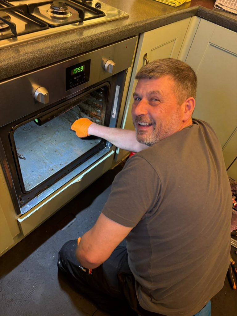 “Professional oven cleaning in Harrogate by Yorkshire Oven Clean — technician deep‑cleaning an oven for a spotless finish.”
